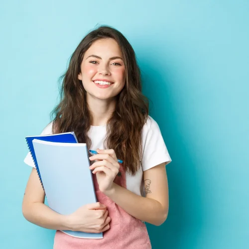 happy-young-female-student-holding-notebooks-from-2023-11-27-05-12-43-utc1 happy-young-female-student-holding-notebooks-from-2023-11-27-05-12-43-utc1